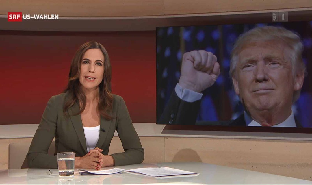 Rundschau-Spezial: Moderatorin Susanne Wille. Im Hintergrund Bild von Donald Trump in Siegespose.